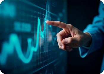 Tela ao fundo e uma mão apontando as linhas do gráfico